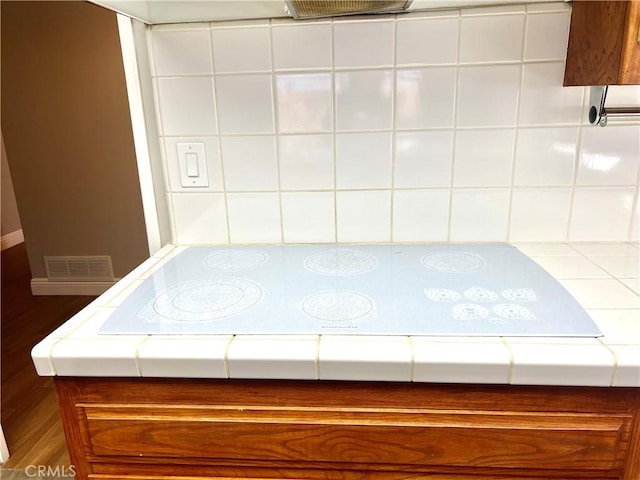 room details featuring backsplash and electric cooktop