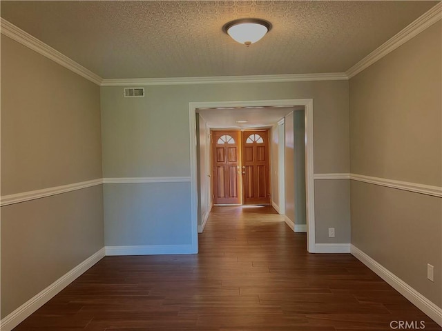 hallway with a textured ceiling, dark hardwood / wood-style floors, and ornamental molding