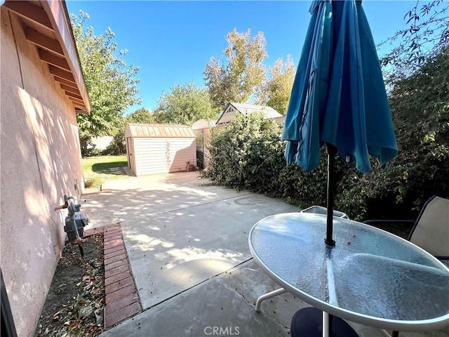 view of patio / terrace with a storage shed