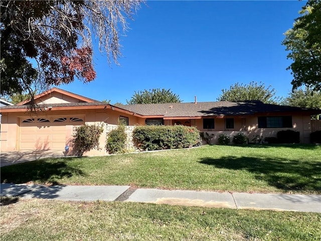 ranch-style home with a garage and a front yard