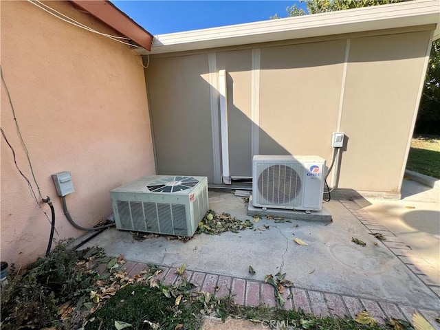 view of patio with ac unit and central air condition unit