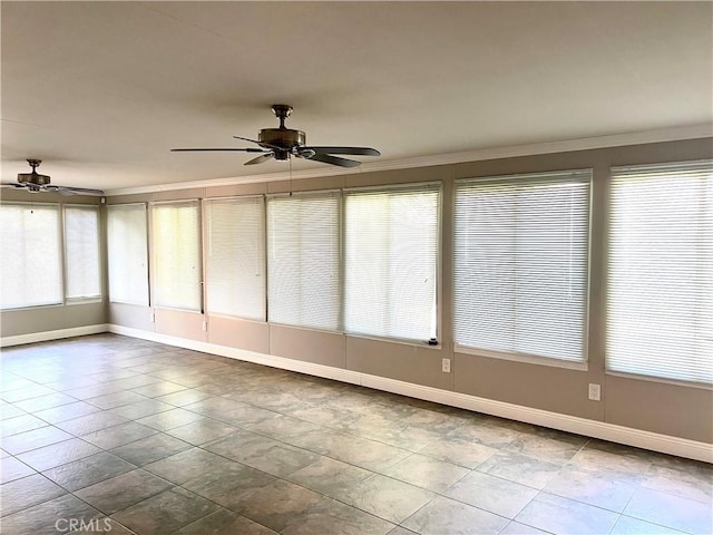 unfurnished sunroom featuring ceiling fan