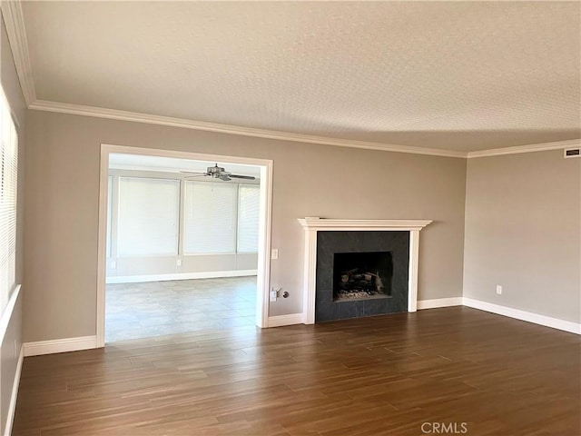 unfurnished living room with a textured ceiling, ceiling fan, a fireplace, and dark hardwood / wood-style floors