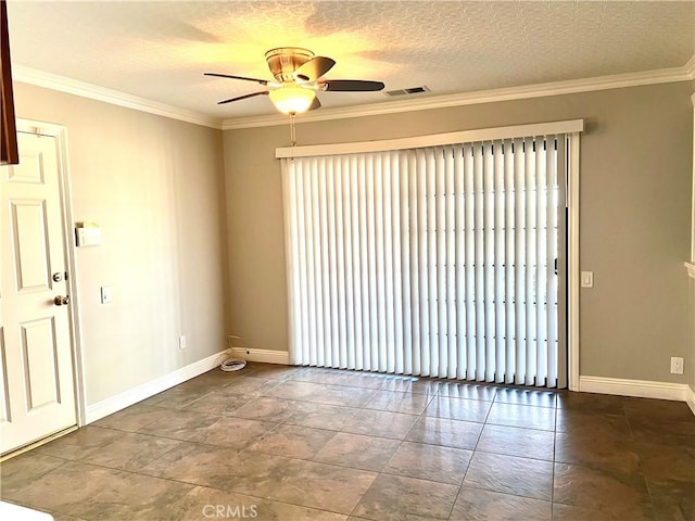 empty room featuring ceiling fan, a textured ceiling, and ornamental molding