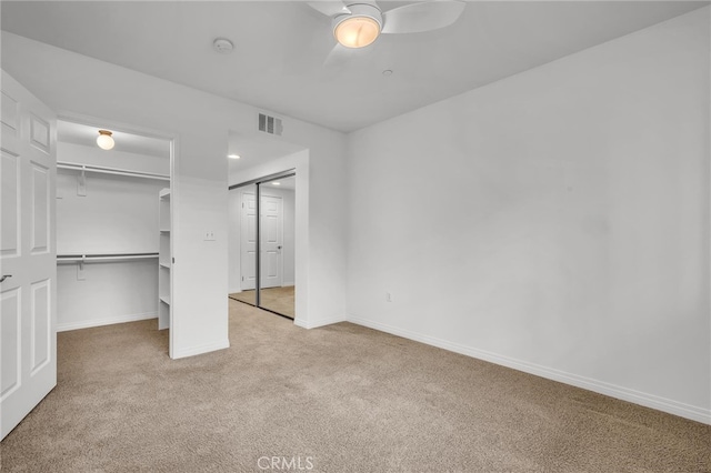 unfurnished bedroom with carpet floors and ceiling fan