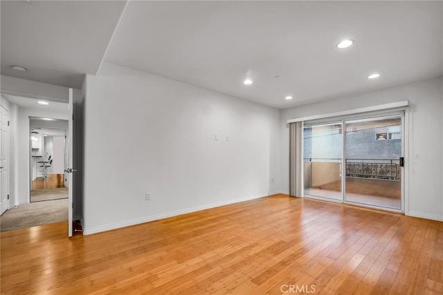 spare room with light hardwood / wood-style floors