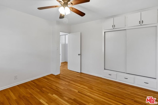 unfurnished bedroom featuring ceiling fan and light wood-type flooring