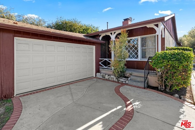 ranch-style home featuring a garage