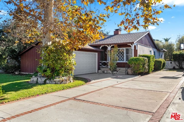 view of front facade with a garage and a front lawn