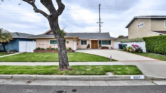 ranch-style home with a front lawn