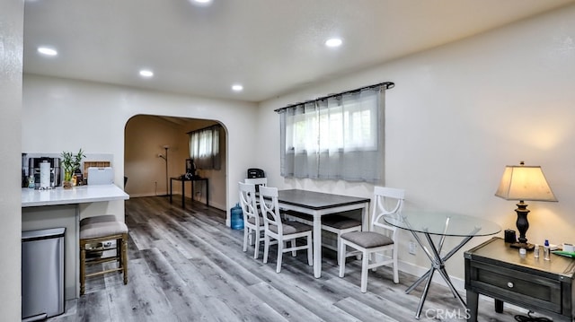 dining room with wood-type flooring