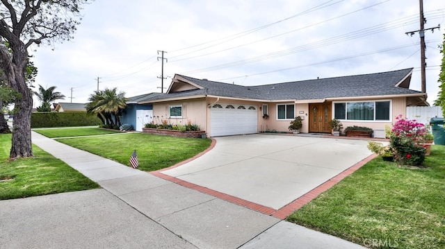 ranch-style home featuring a front lawn and a garage