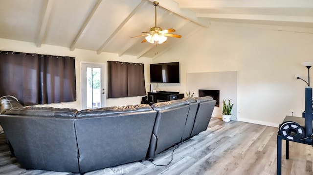 living room with ceiling fan, high vaulted ceiling, beamed ceiling, and light hardwood / wood-style flooring