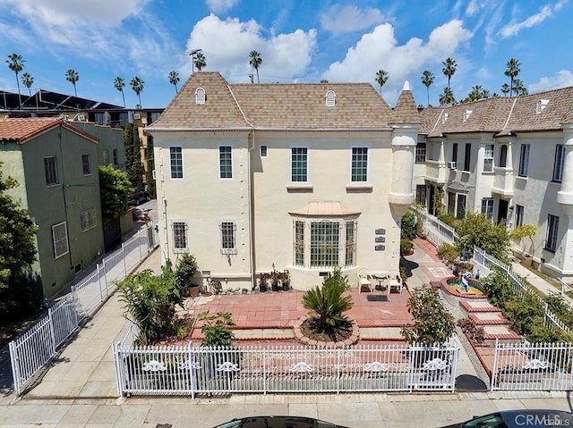 back of property featuring a patio area