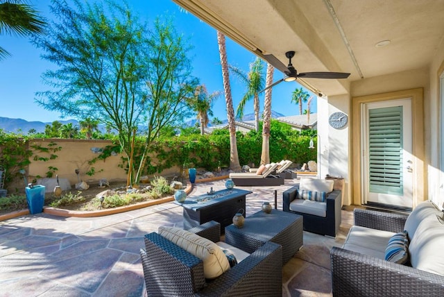 view of patio with ceiling fan and outdoor lounge area