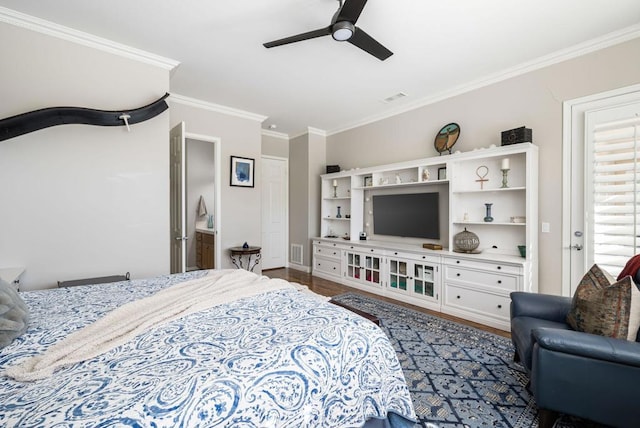 bedroom featuring ceiling fan, crown molding, and hardwood / wood-style floors