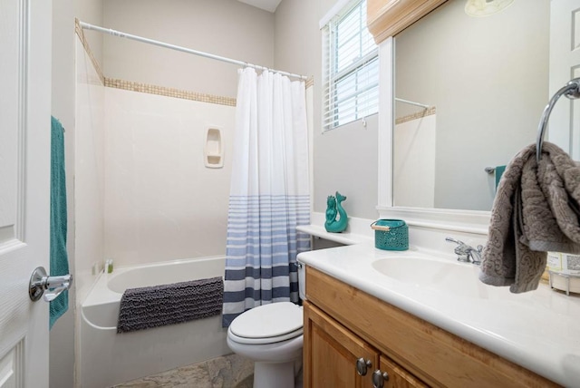 full bathroom featuring toilet, vanity, and shower / tub combo