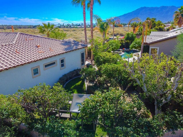 birds eye view of property with a mountain view