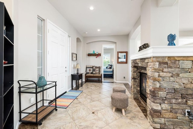 interior space with a stone fireplace