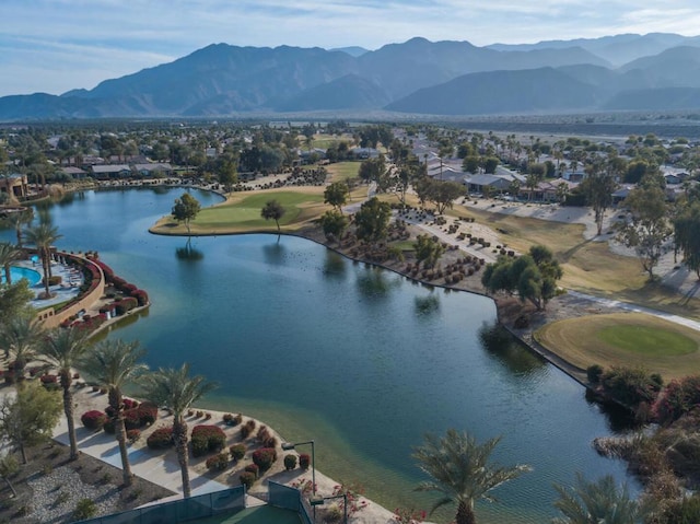 drone / aerial view with a water and mountain view