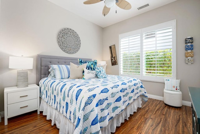 bedroom with ceiling fan and dark hardwood / wood-style floors