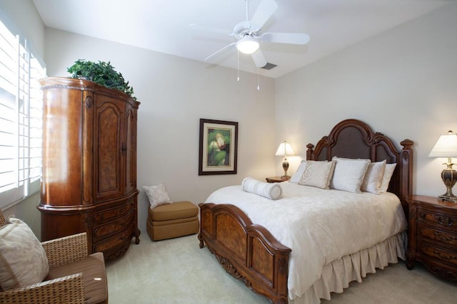 bedroom with light colored carpet and ceiling fan