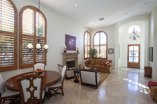 interior space featuring a notable chandelier and a healthy amount of sunlight