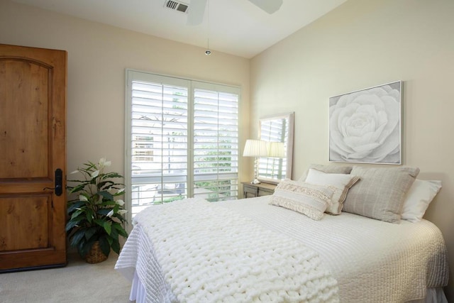 bedroom featuring light carpet, ceiling fan, and lofted ceiling