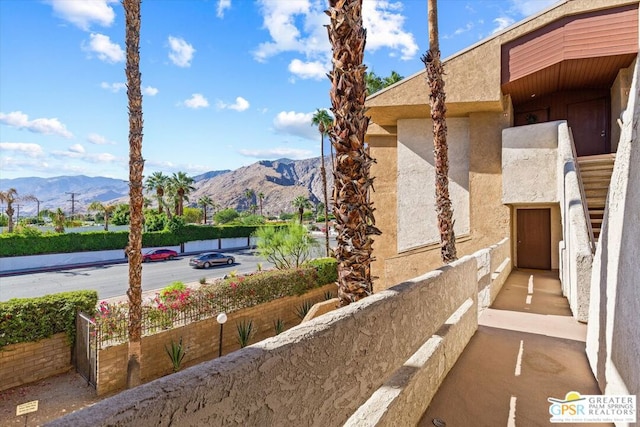 view of property exterior with a mountain view