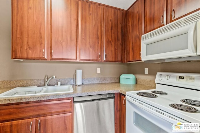 kitchen featuring sink and white appliances