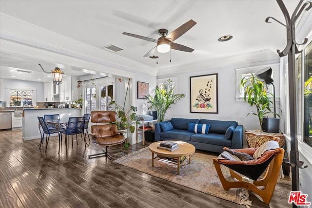 living room featuring ceiling fan, dark hardwood / wood-style flooring, and crown molding