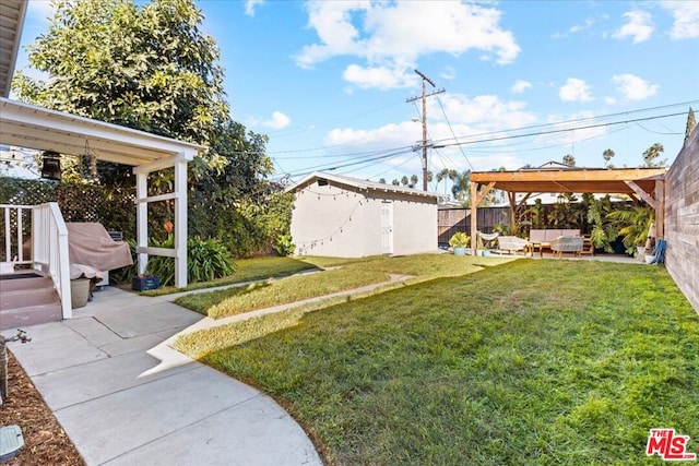 view of yard featuring a storage unit, an outdoor living space, a patio, and a pergola