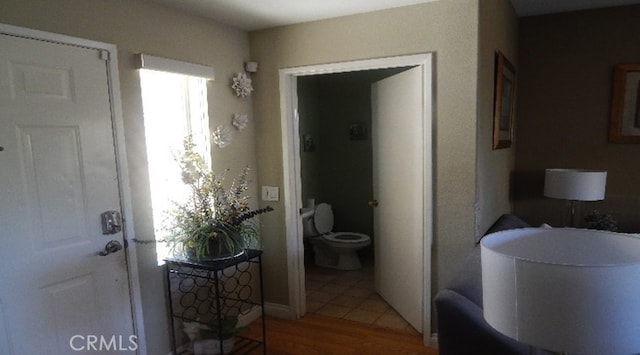 hallway featuring tile patterned flooring