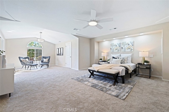 bedroom featuring ceiling fan, vaulted ceiling, and light colored carpet