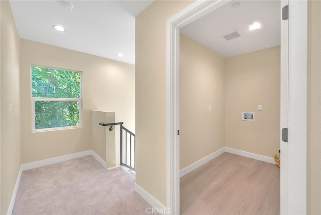 interior space featuring light carpet
