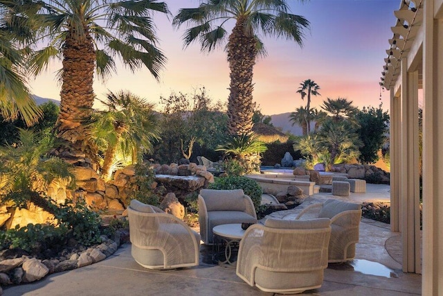 view of patio terrace at dusk