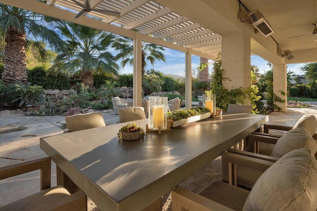 view of patio / terrace featuring ceiling fan and a pergola