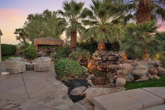 patio terrace at dusk with a gazebo