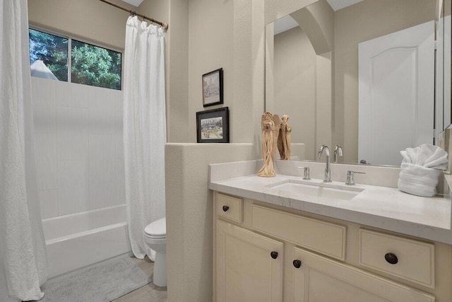 full bathroom with shower / bath combo, vanity, and toilet