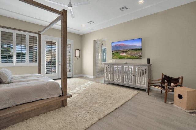 bedroom featuring ceiling fan, access to exterior, and light hardwood / wood-style floors