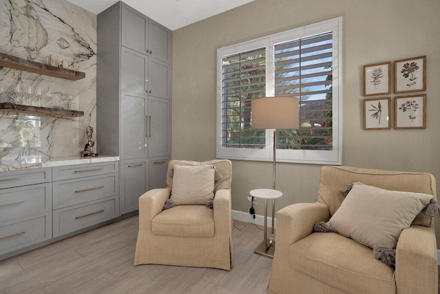 sitting room with light hardwood / wood-style floors