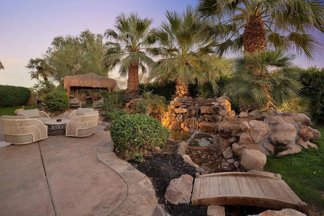 patio terrace at dusk with a gazebo