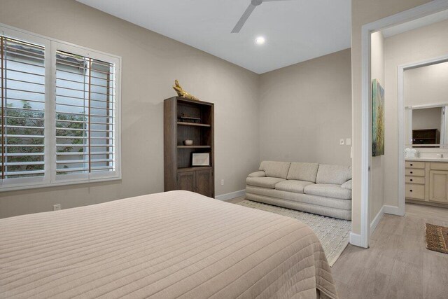 bedroom with ceiling fan and light wood-type flooring