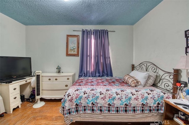 bedroom featuring a textured ceiling