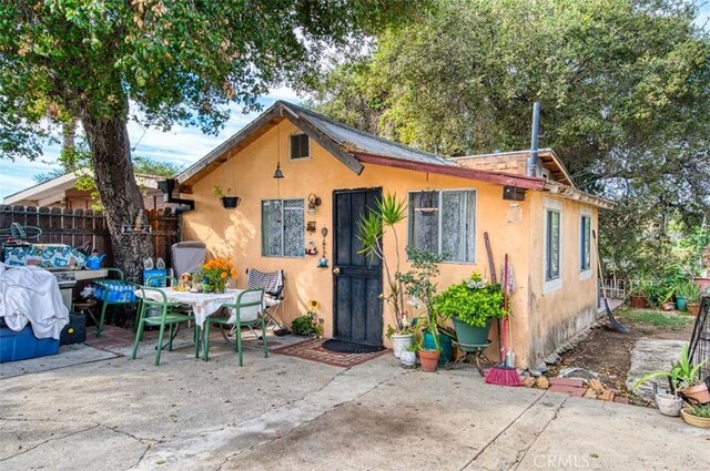 bungalow-style home featuring a patio