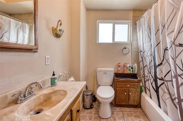 full bathroom featuring vanity, toilet, and shower / bath combination with curtain