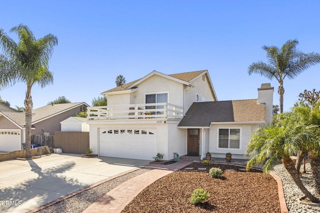 front facade featuring a garage and a balcony