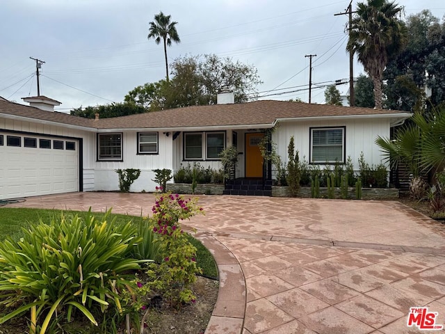 ranch-style home with a garage