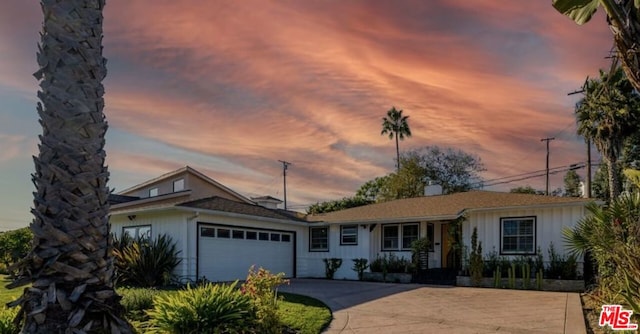 single story home with a garage