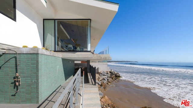 property view of water featuring a beach view